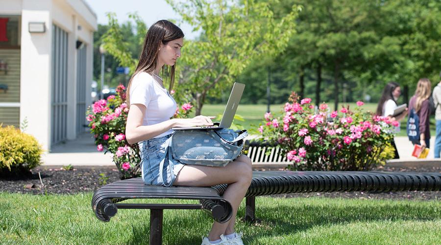 young female student using her laptop to set up VitaNavis account